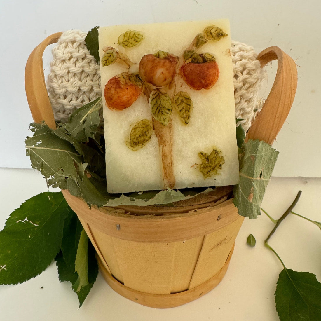 handmade soap, cold process handknitted face cloth, dried botanicals and apples.