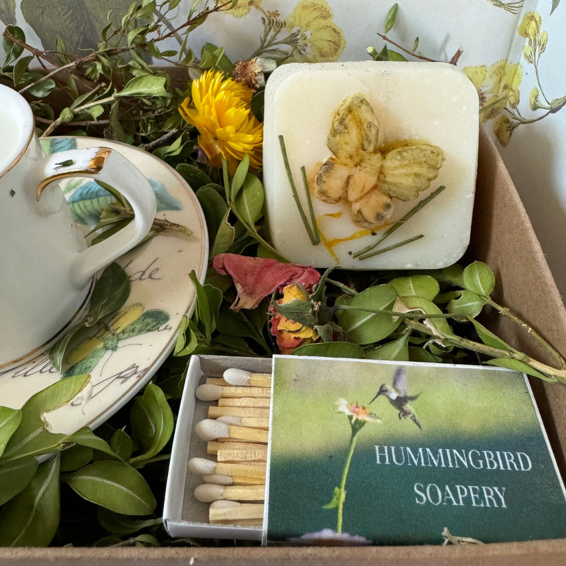 cup and saucer soy candle, all natural soap, cold process, essential  oils bergamot and lavender, kraft gift box with botanicals and dried flowers.